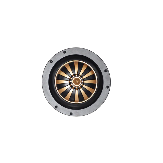 Round metallic object with a black and gold design on a white background