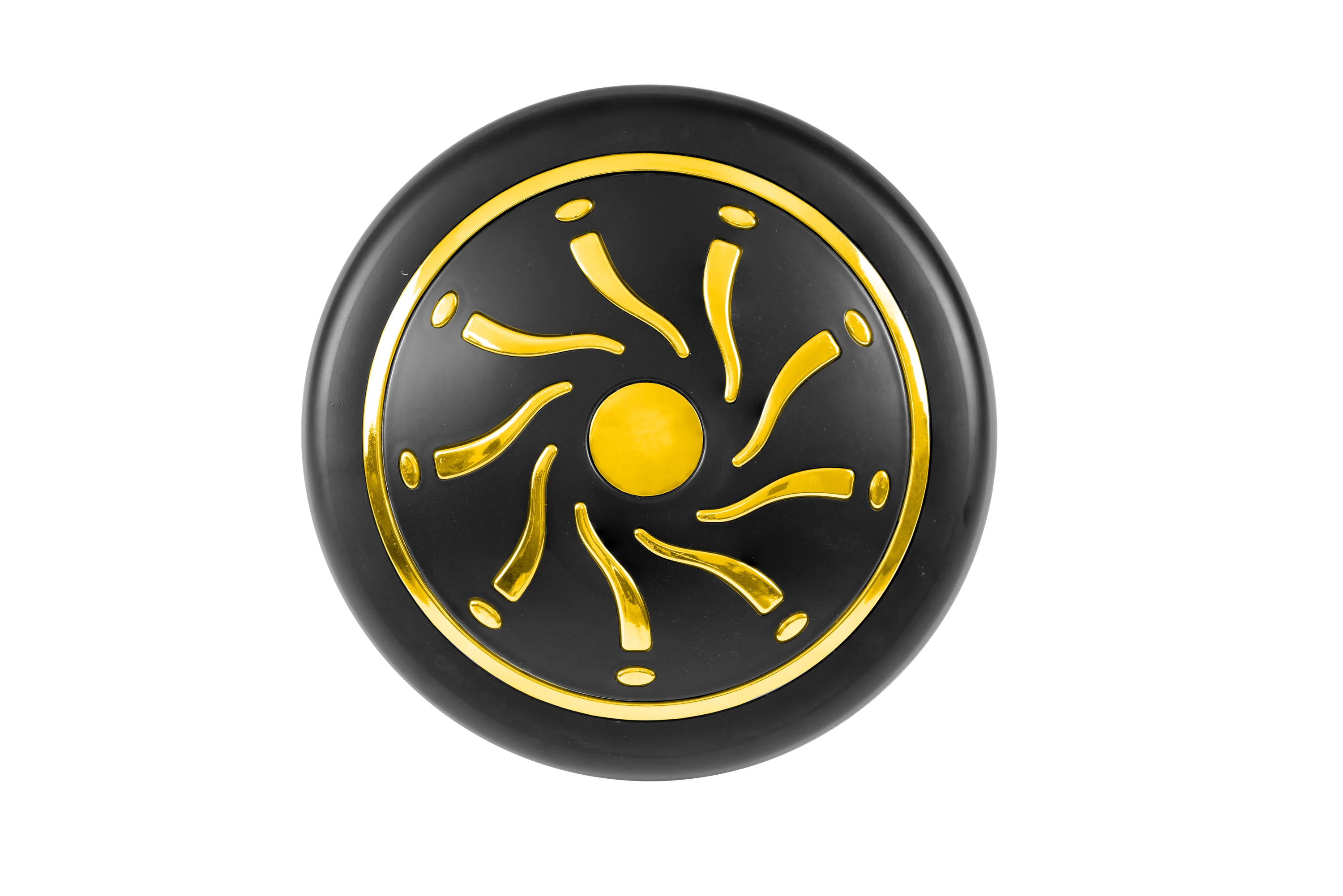 Black circular object with gold sun-like design on a white background