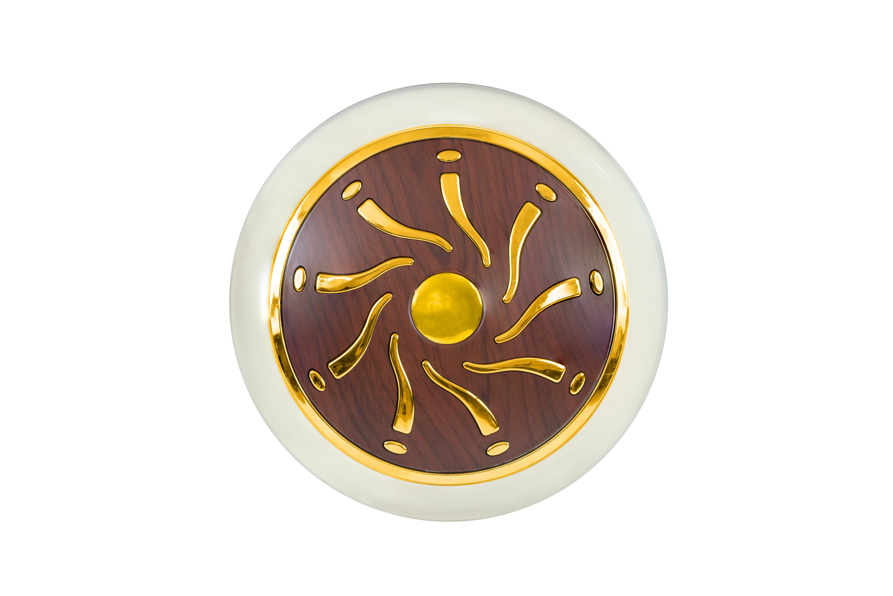 Decorative circular object with gold and brown design on a white background