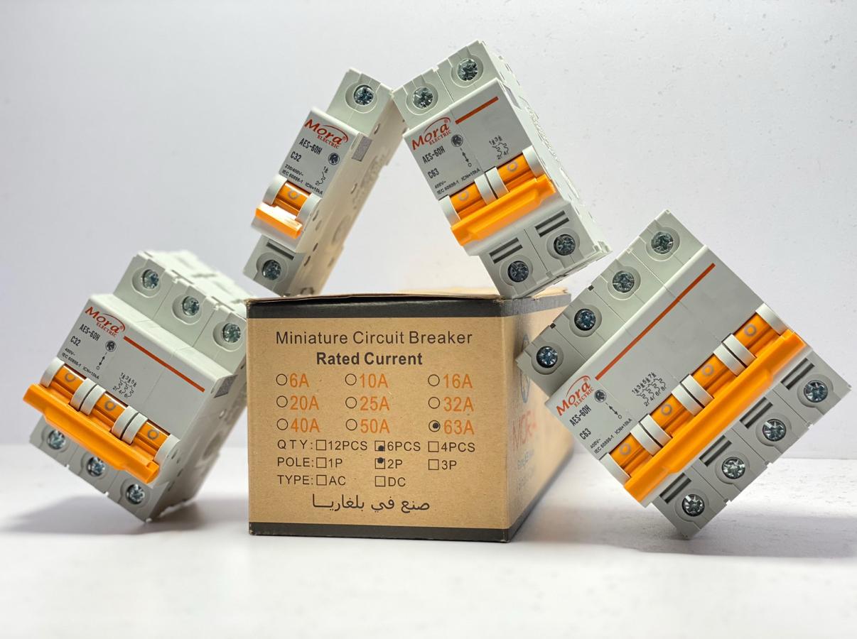 Miniature circuit breakers on a cardboard box with a white background